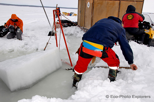 surface crew preparing ice hole