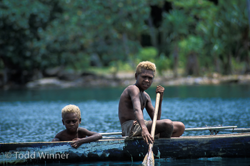 children in a boat, papua new guinea
