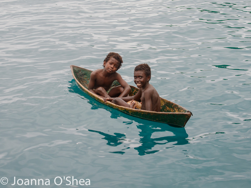 If you dive the Solomon Islands by liveaboard, you will likely make new friends as they paddle up to the boat. Photo: Jo O'Shea