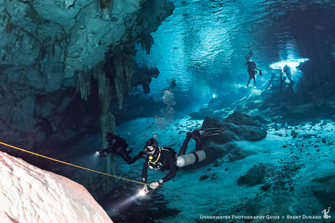 Our guide Nico begins the Barbie Line of Dos Ojos cenote with snorkelers in the background. ISO 6400, f/4.5, 1/25