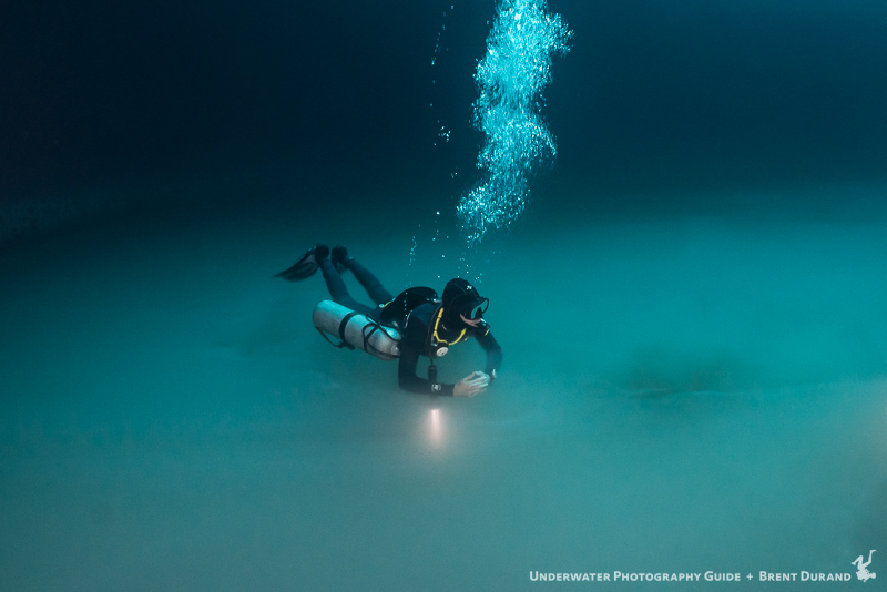 Nico hovers above the surfer layer of Angelita cenote. ISO 2000, f/5, 1/20