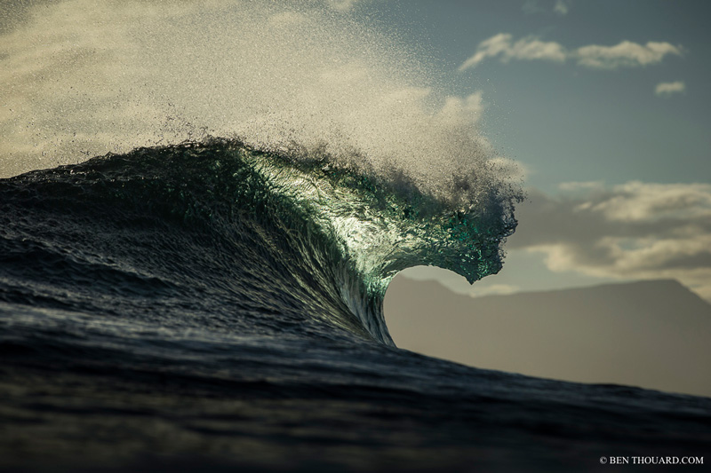 The sun setting behind the wave lights up the lip of the wave, which creates those colors. Canon EOS 1DX + 70/200mm f/2.8L IS USM II inside a Aquatech Delphin 1D housing with 70-200 lens port. ISO 200, f/8, 1/2000
