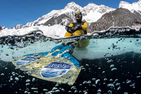 Valentina Cafolla sits on the ice edge at Lago Di Anterselva Lake. Photo: Predrag Vuckovic