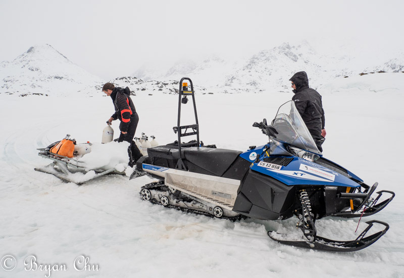 Snowmobile delivering tanks and camera. Notice pile of snow on front of sled that was kicked up by snowmobile. Olympus OM-D E-M1 Mark II, Olympus 12-100mm F4.0 lens.