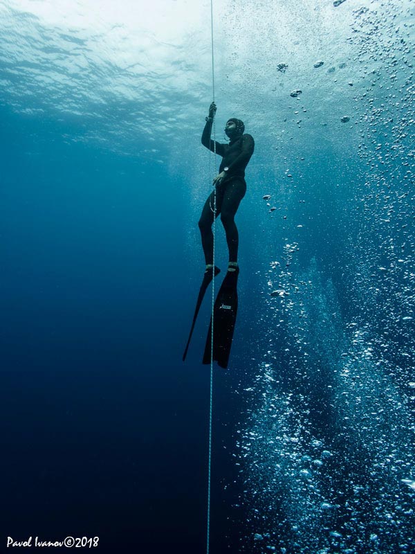 Freediver on the line with bubbles. Olympus TG-5, Olympus housing, Olympus PTWC-01 wet wide angle lens, iDiving video lights. 4.5mm focal length, ISO 200, 1/200 sec, f/2.8, EV -0.3.