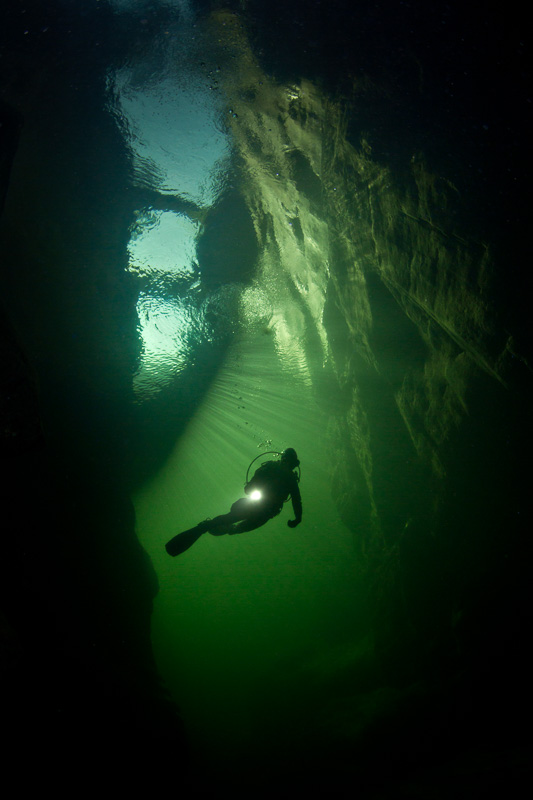 Diver inside a submerged canyon: Orrido di S. Anna. Model: Mari Lasco. Canobio, Piedmont Shot with Canon 5D Mark III. 1/125 sec, f/16, ISO 400, Tokina 10-17, 1.4 TC Kenko, Nauticam 4.33 minidome.