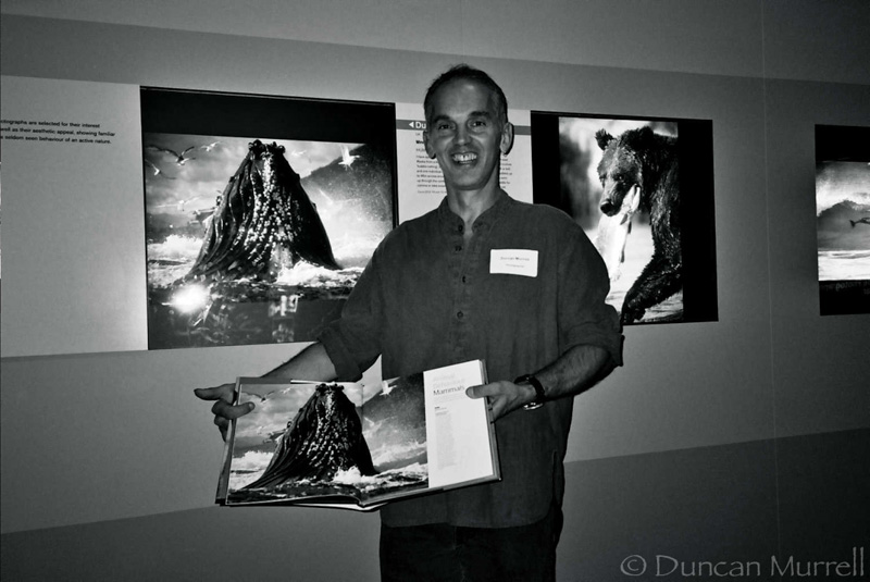 Photo taken of Duncan with his winning photo at the exhibition for the BBC Wildlife Photographer of the Year Competition in 2002.