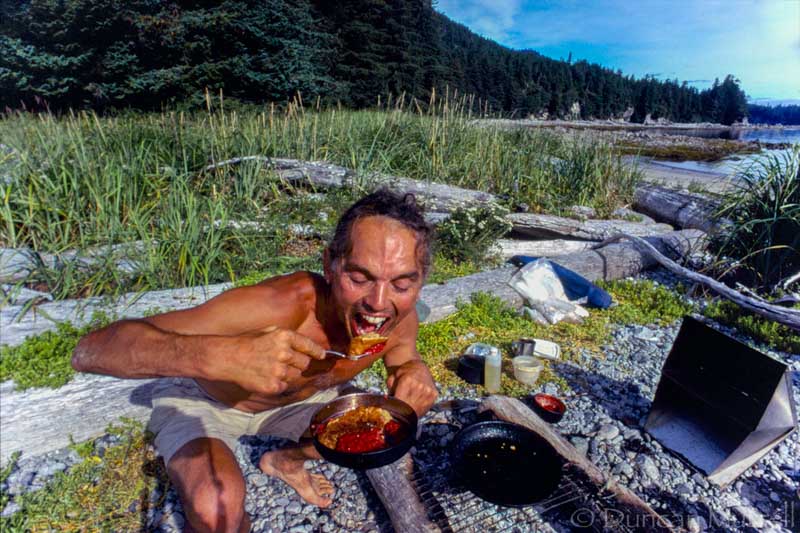 One of Duncan’s early selfies circa 1988. He’s having his favorite breakfast of multigrain pancakes with freshly picked huckleberries boiled into a sauce. This was at Point Hayes, one of his regular camps for photographing bubblenet feeding by humpback whales just offshore.